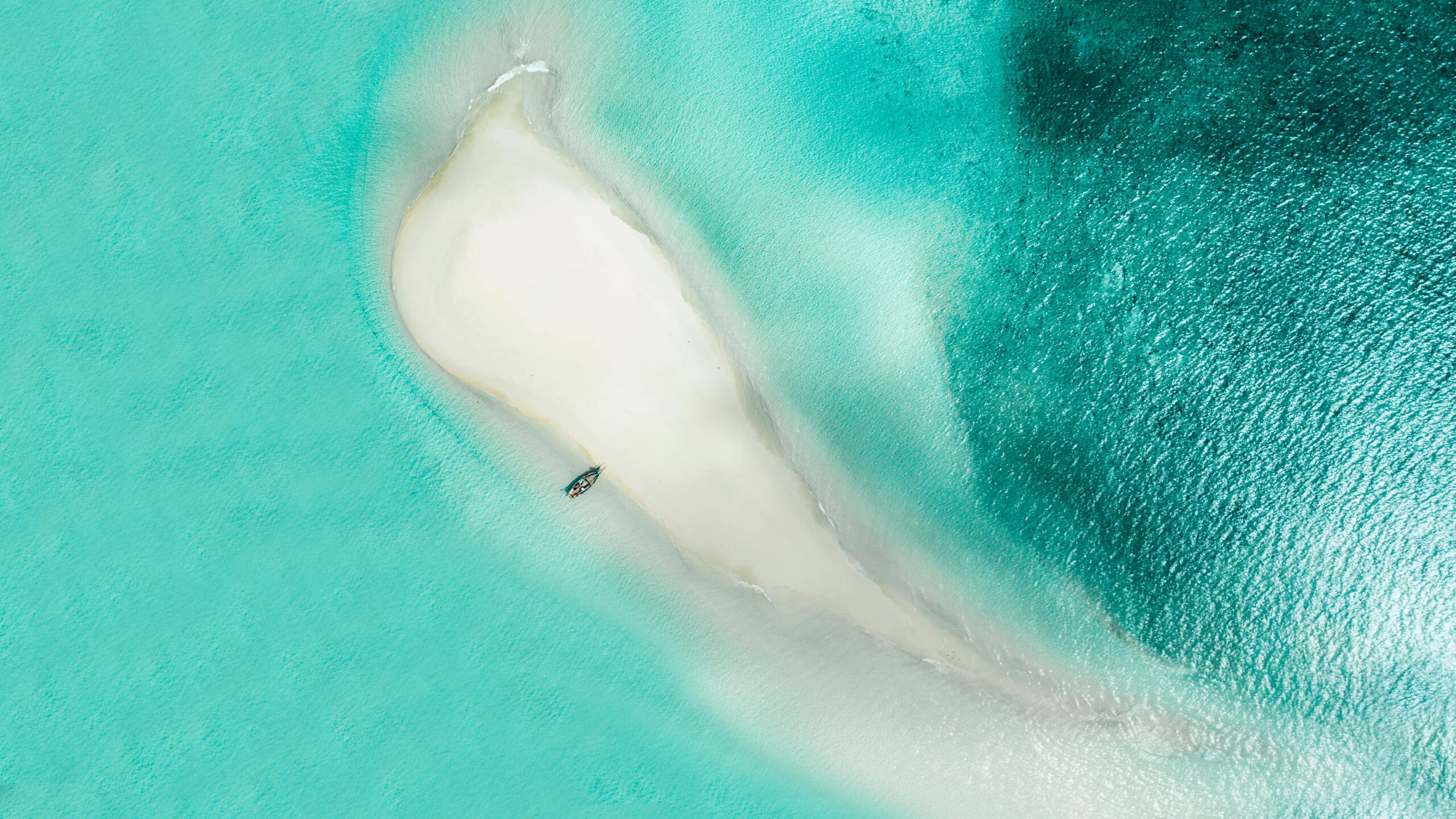 Stunning aerial view of a sandbar surrounded by turquoise waters in Zanzibar, Tanzania.